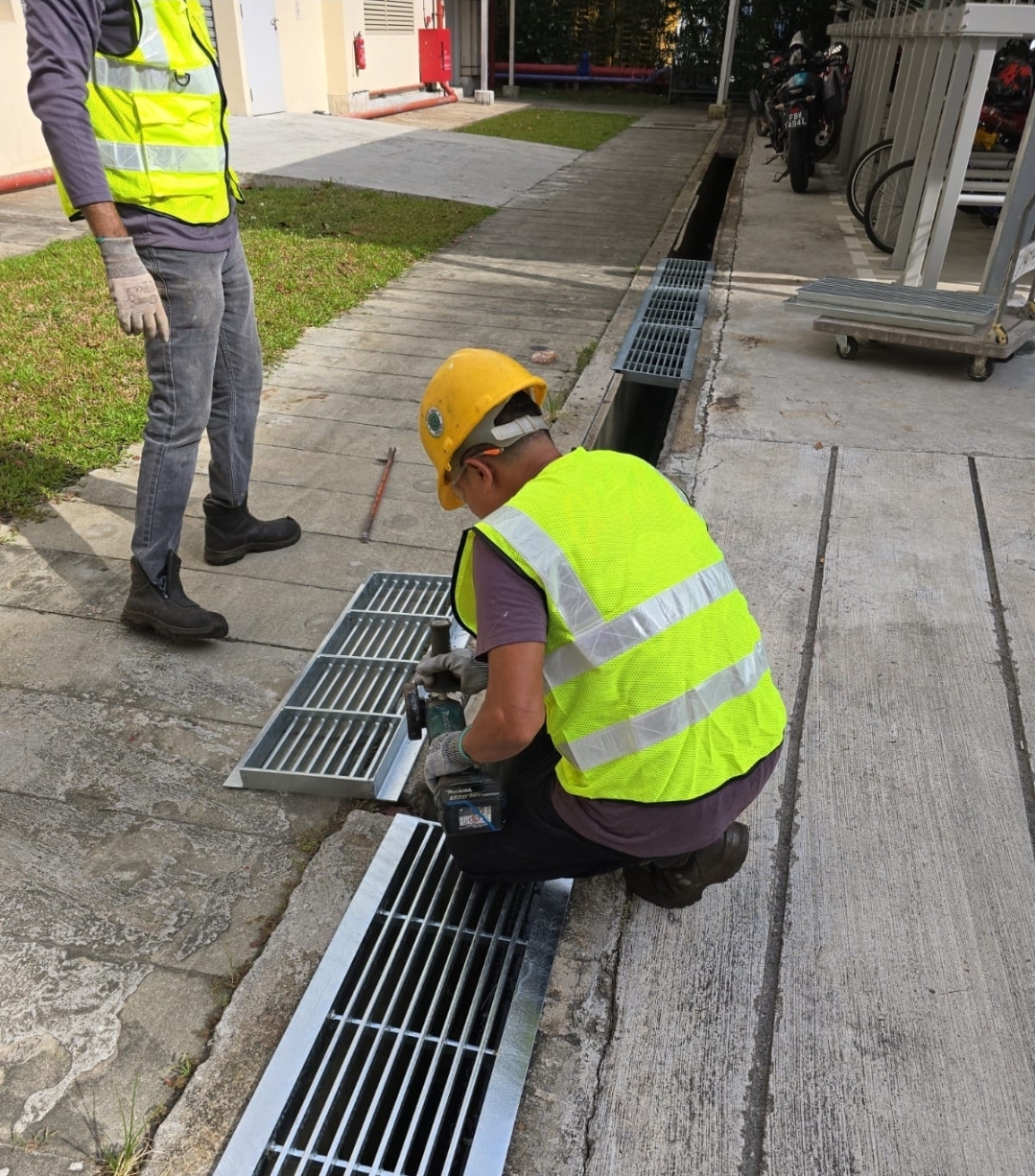 Before: Corroded drain cover